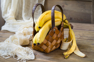 Fresh yellow bananas in a wicker basket