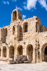 Stone facade and arcades of Odeon of Herodes Atticus Roman theater, Herodeion or Herodion, at slope of Athenian Acropolis hill in Athens, Greece