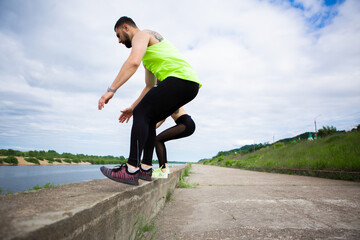 Athletic guy and girl synchronously jump. Healthy sport lifestyle. Photography for ad or blog