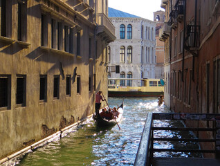 Gondola in Canal in Venice at Golden Hour