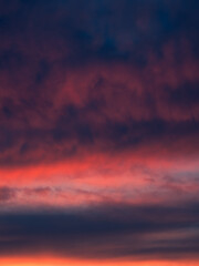 Dramatic sunset with a twilight dark blue color of the sky and clouds. Nature is an abstract composition