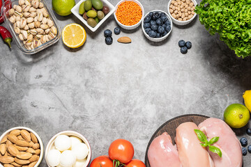 Fresh raw food on dark stone table. Food delivery concept. Balanced ration. 