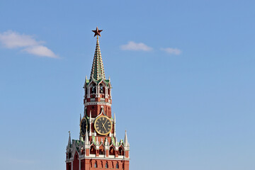 Chimes of Spasskaya tower, symbol of Russia on Red Square. Moscow Kremlin tower isolated on blue sky background