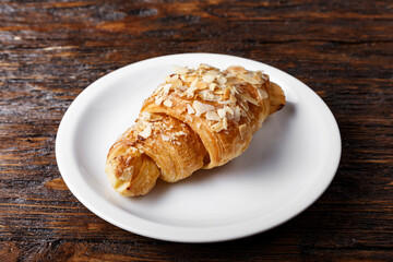 fresh croissant on a wooden table