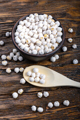 raw chickpeas on wooden background