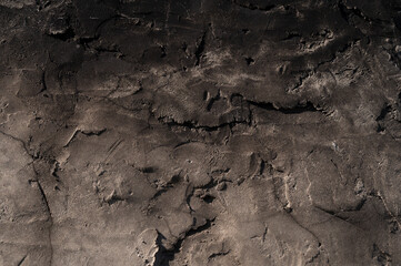 background texture of the walls are covered with grey cement mortar with a rough surface are not aligned and annealed in black surface
