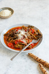 Healthy Sauteed green cicory and tomatoes topped with caccioricotta cheese