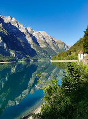 Swiss mountains and Lake. Scenic Alps and lane view. Trekking an