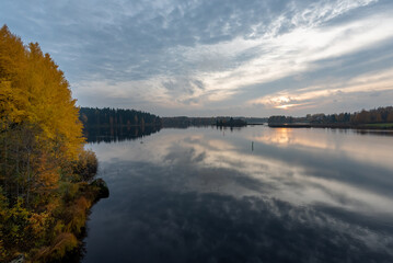 lake in autumn with reflections in Finland