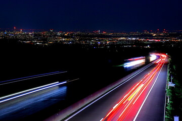 city and freeway at night panorama with long exposure 