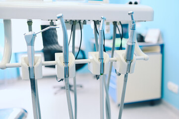 Different professional dental equipment, instruments and tools in a dentists stomatology office clinic.
