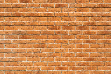 Blank decorative grungy stonewall. Panoramic background of wide old red brick wall texture.