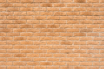 Blank pink decorative grungy stonewall. Panoramic background of wide old red brick wall texture.