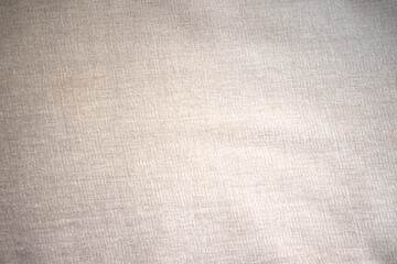 Beige cloth fabric texture for backdrop. Cloth background. Space for text. 