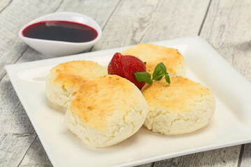 Curd pancakes with jam and stravberry