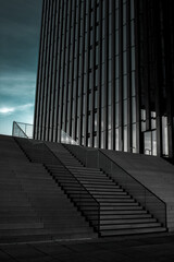 Building and stairs in a cloudy dark day