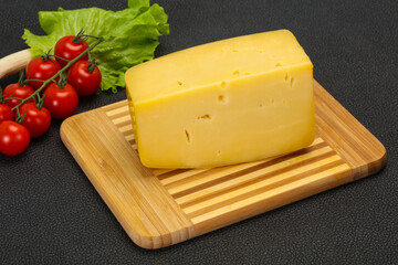 Hard yellow tasty cheese brick