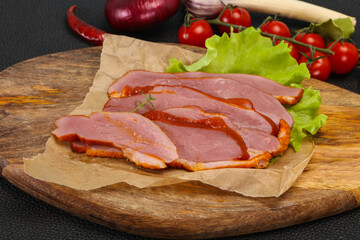 Sliced smoked duck breast served salad