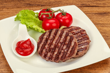 Grilled burger cutlet with sauce
