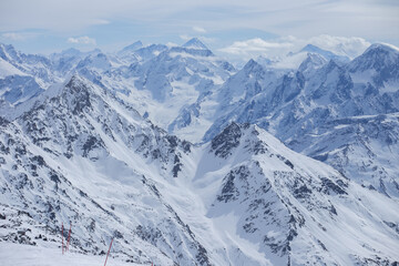 Fototapeta na wymiar snow-capped mountain peaks of the main Caucasus range
