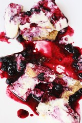 Delicious vanilla cheesecake with blueberry sauce macro