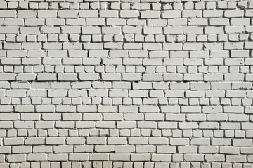 White brick wall background. A brick wall of rough white brick. Brutal abstract grunge background.