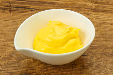 Natural cheese sauce in the bowl