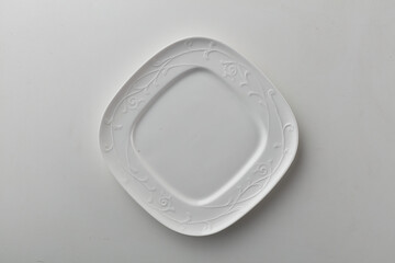 Top view shot of a squarish plate on white background.