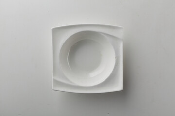 Top view shot of a squarish plate on white background.