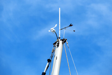 Weather vane and anemometer on a yacht.