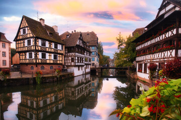 Beautiful view of Strasbourg France at sunset with half timbered architecture and canal in view