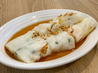 Chee Cheong Fun - Chinese steamed rice rolls with dried shrimp and spring onion served with hoisin sauce, soybean paste and chili dip.