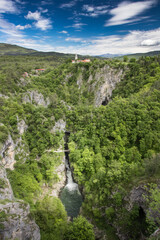 Fototapeta na wymiar Škocjan caves Slovenia church Reka river water stream waterfall green spring foliage