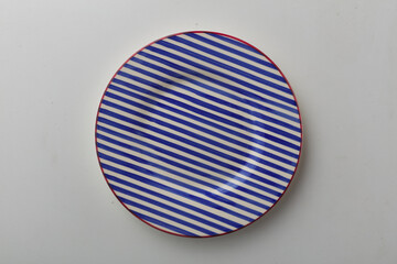Top view shot of a plate on white background.