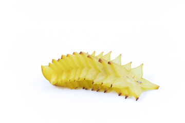 a delicious looking star fruit cut in slices on a light background. Healthy and vegan food concept.