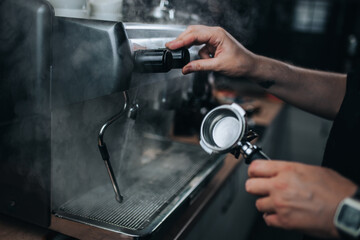 Interior and equipment of a professional bartender - coffee machine and barista dishes in a cafe
