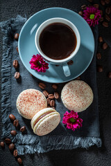 Obraz na płótnie Canvas Delicious coffee macaroons as a tasty dessert