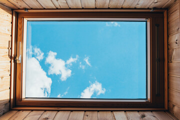 Clear blue sky rectangle inside view through the roof window