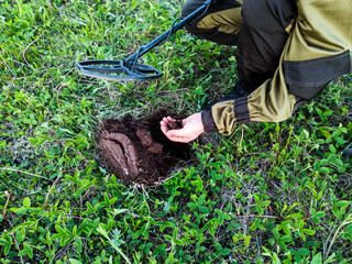 Man with metal detector, magnetic hobby,magnetic coil