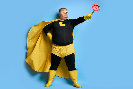 let's save the planet from dirt portrait of cleaning fat man in yellow costume isolated over blue background