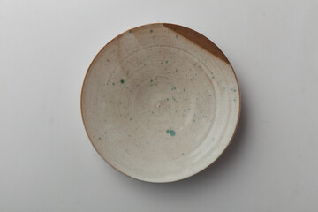 Top view shot of a plate on white background.