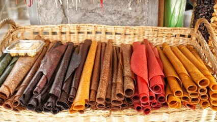 Tklapi - traditional georgian fruit pastila selling at market. . Delicious and healthy Georgian desserts.