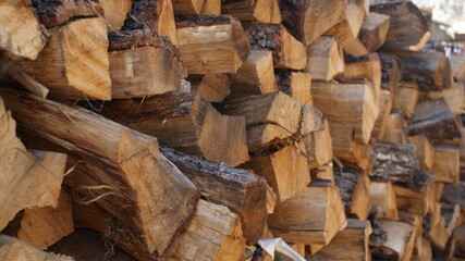 logs lie on top of each other for heating in a home oven. Background of firewood