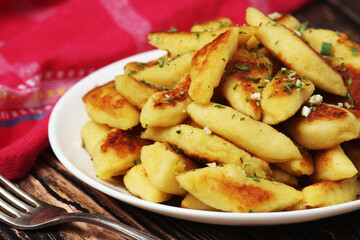 Polish dish kopytka served at the table
