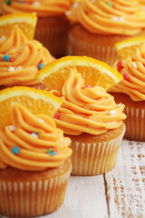 Cupcakes with orange icing on top