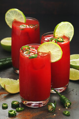 Jalapeno tomato margarita cocktail with lime