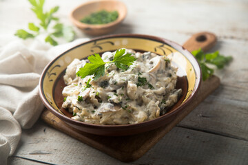 Homemade mushroom stew with cream and parsley