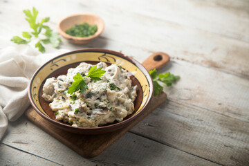 Homemade mushroom stew with cream and parsley