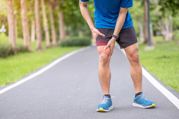 Young adult male with muscle pain during running. runner have leg ache due to Iliotibial Band Syndrome – ITBS. Sports injuries and medical concept