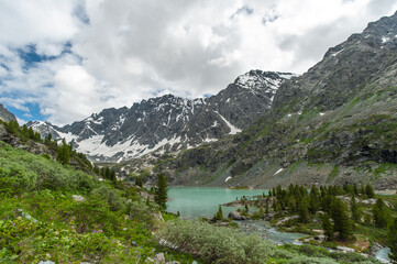 Turquoise lakes in the Altai Mountains and blue sky in the clouds of nature